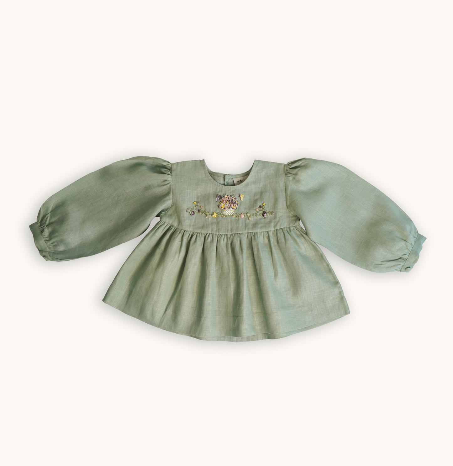 Baby girls' linen floral embroidered top, featuring hand-embroidered flowers, perfect for stylish and comfortable baby wear. Ideal for baby fashion and organic luxury clothing collections